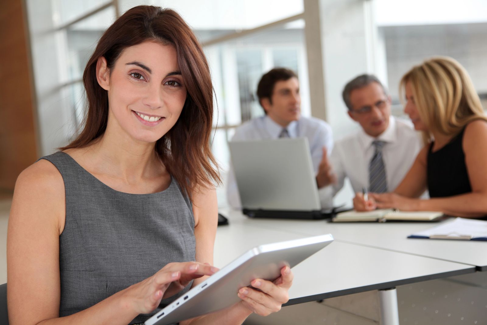 A manager reviewing information on a tablet