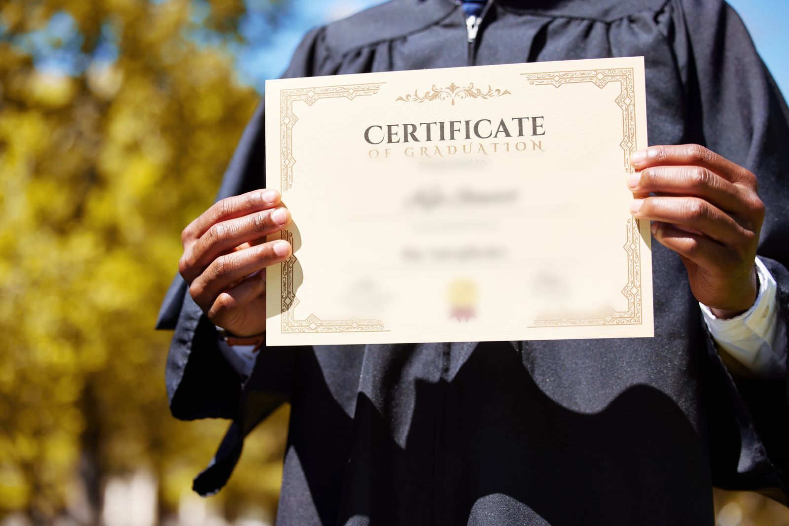 Hands holding a diploma